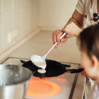 https://www.pexels.com/photo/mother-and-child-preparing-crepes-3807333/