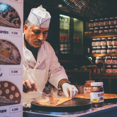 https://www.pexels.com/photo/person-cooking-inside-kitchen-1397514/