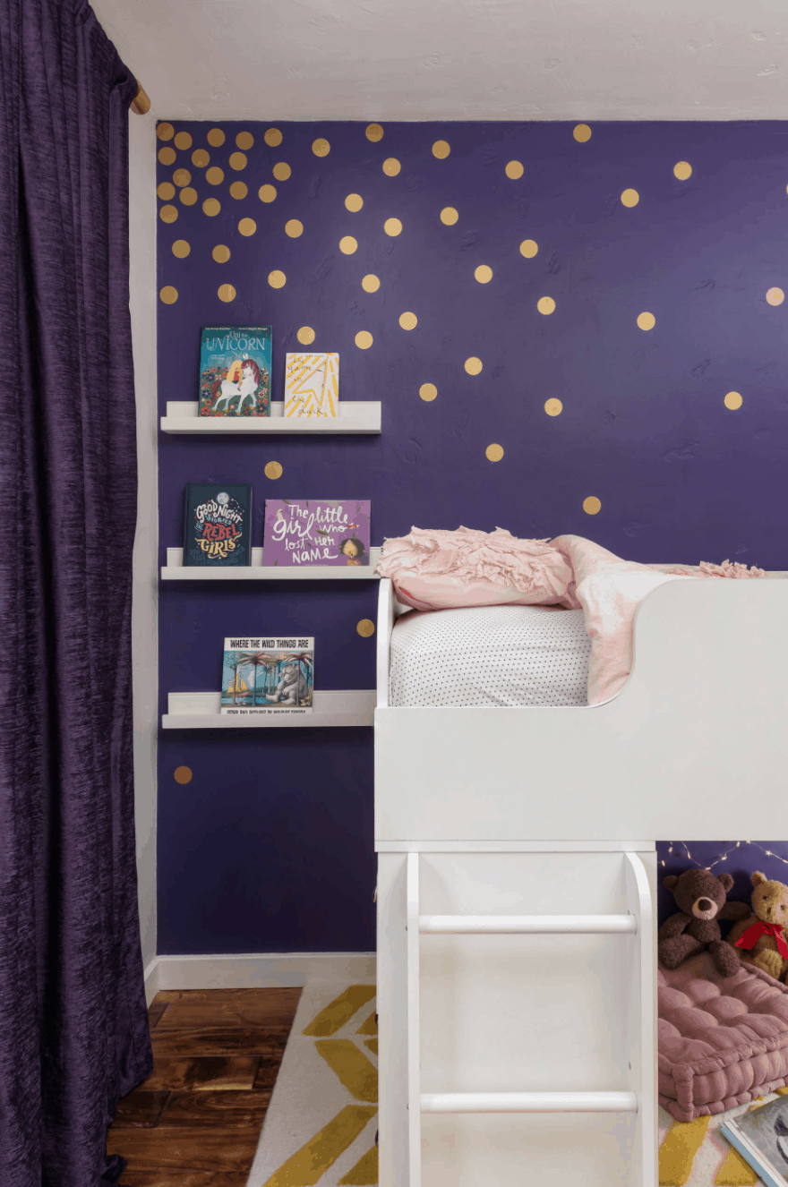 gold decals on purple walls