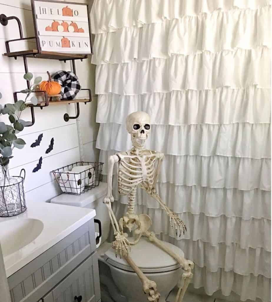 skeleton on the toilet