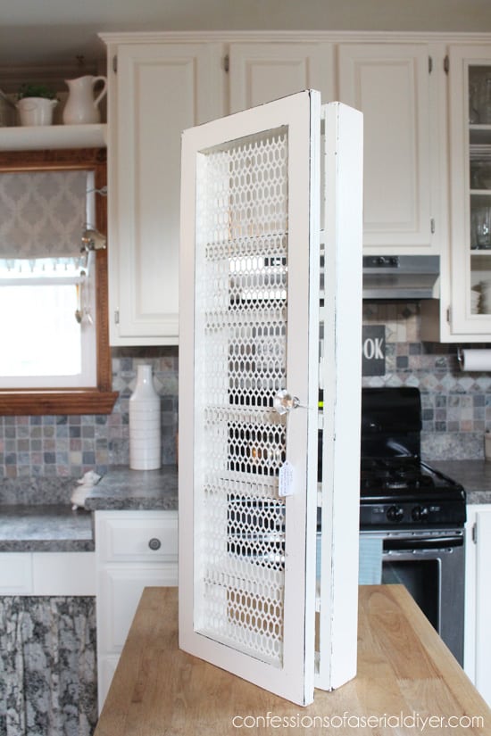 side of cabinet mounted spice rack