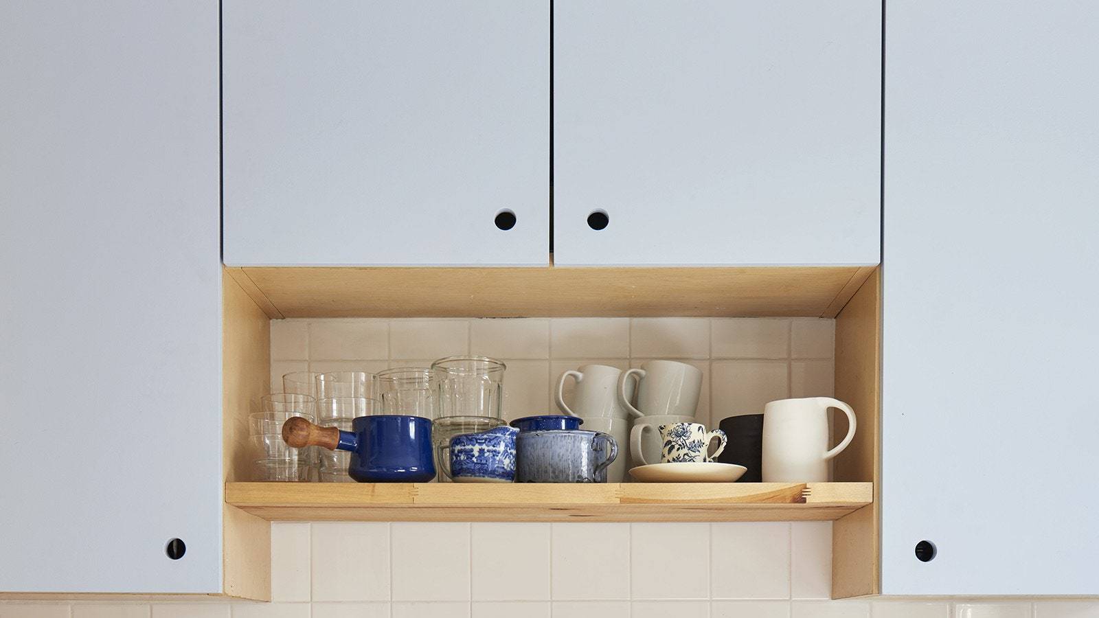 Grayish Blue Cabinets With Cutout Cabinet Pulls