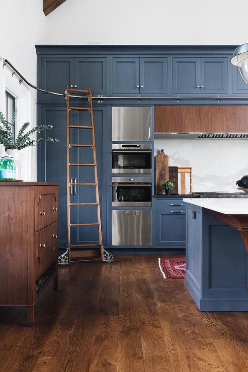 Sky-High Cabinets With A Rolling Ladder