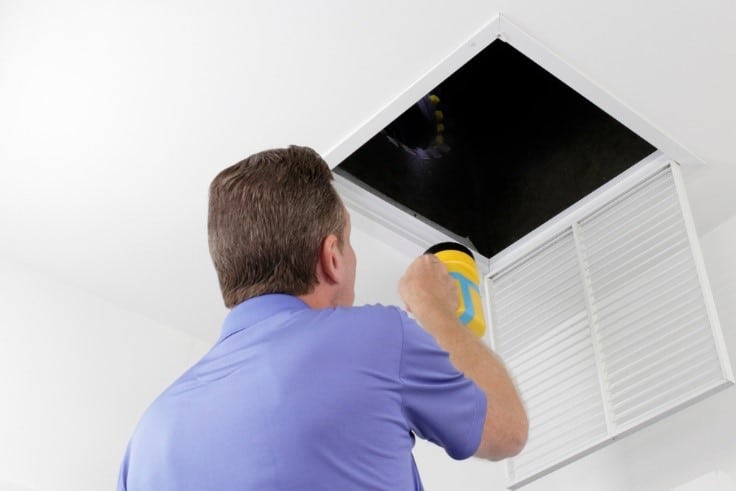 Expert checking the duct