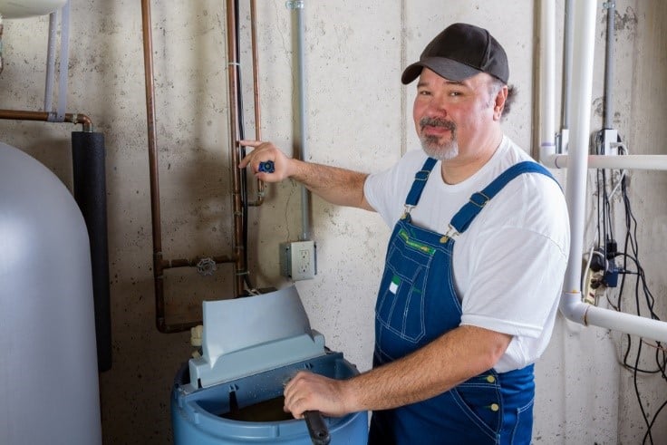 Expert installing a water softner