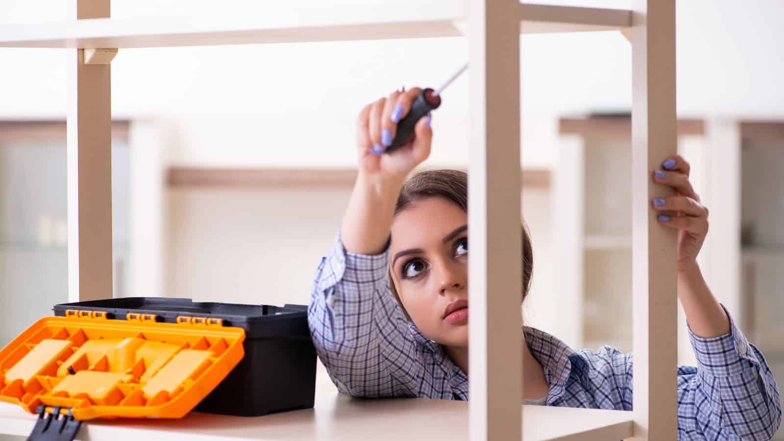 woman assembling furniture