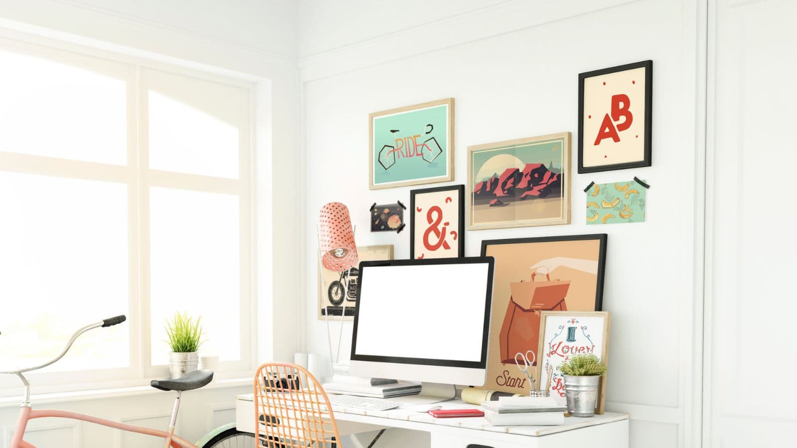 workspace area with varying artworks on the wall