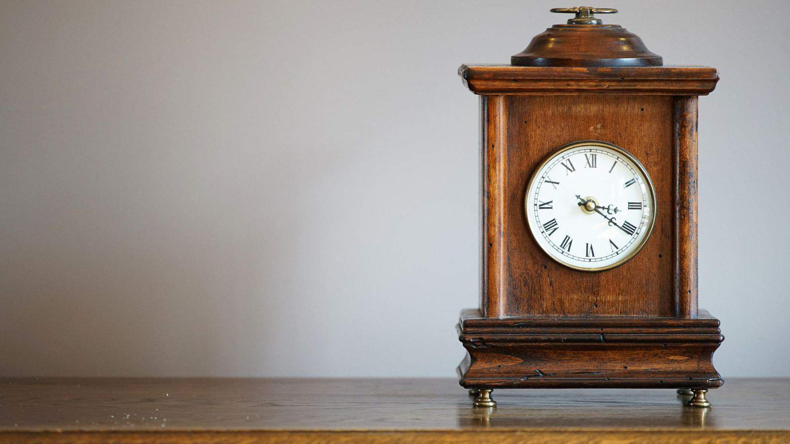 Table clock of the old wooden frame of the room