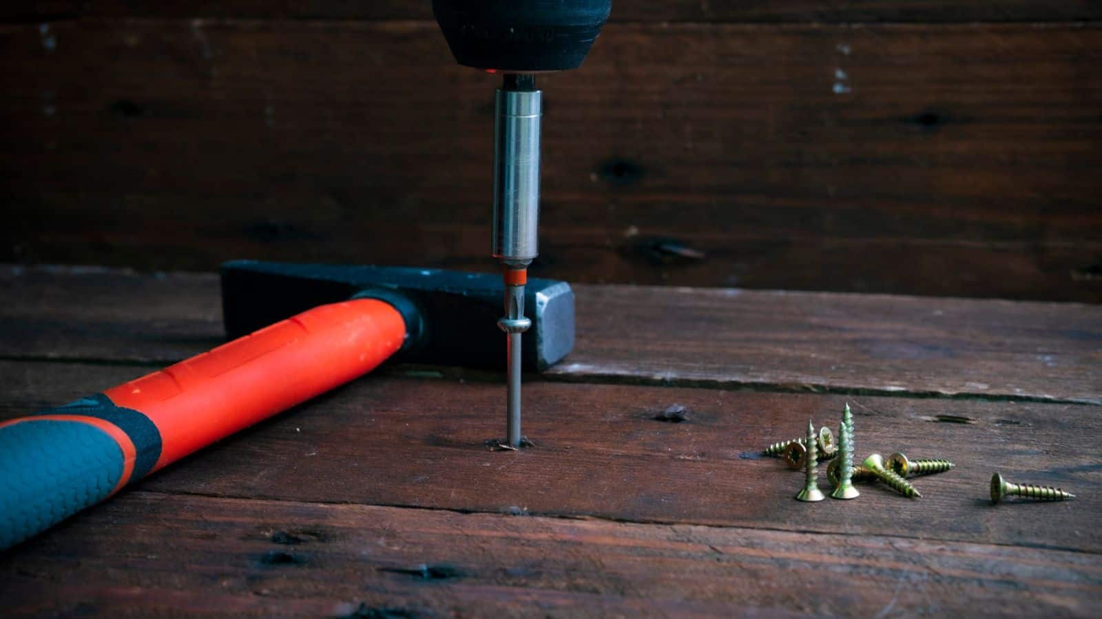fixing squeky floorboards using a screw and a drill