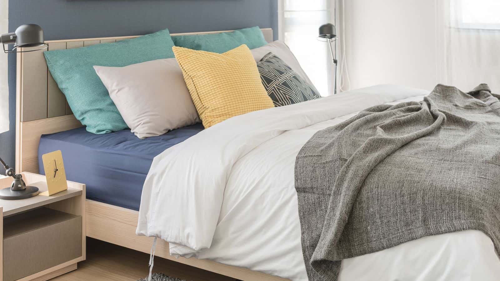 Modern bedroom bedding with colorful pillows