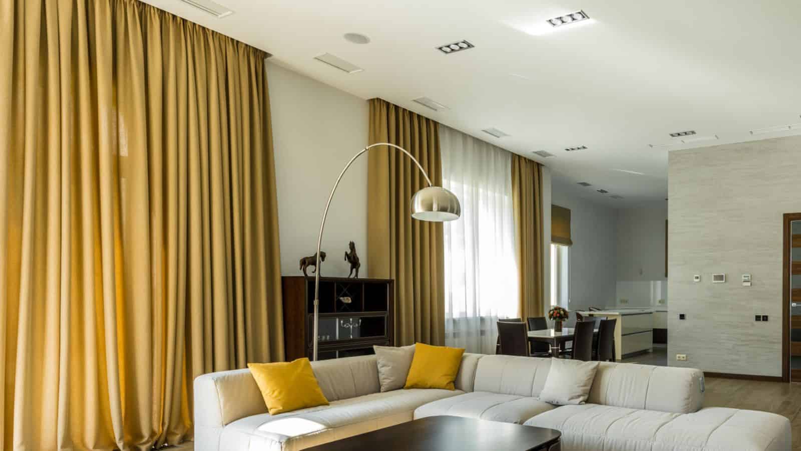 modern living room with sofa and table and high quality curtains